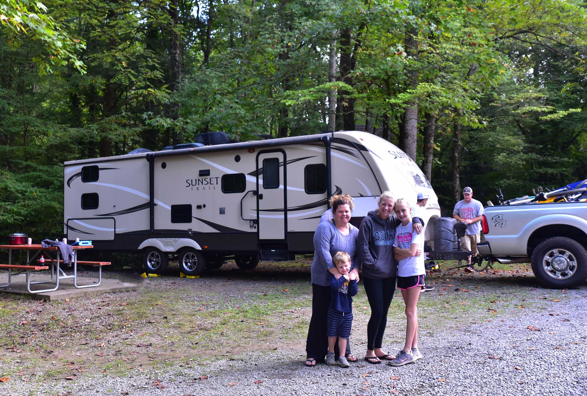 New Campers in front on an RV